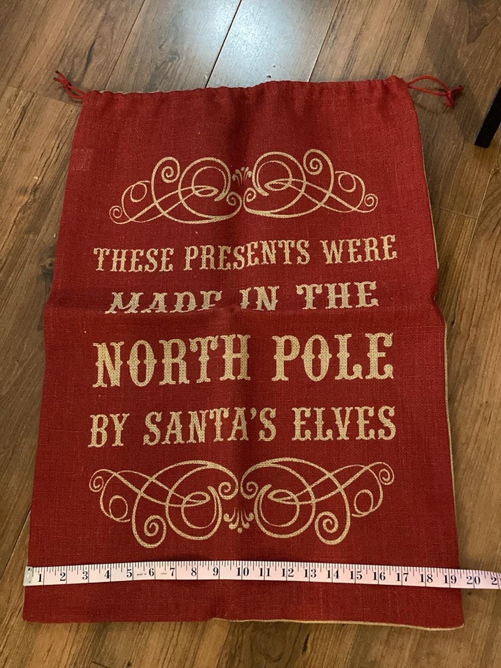 Red Holiday Gift Sack with Gold 'North Pole' Lettering